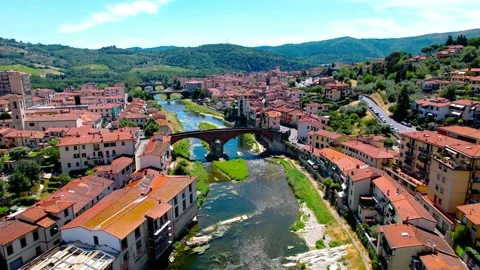 Aerial flight 4k view reverse from three Pontassieve River's Bridge Tuscany IT Stock-Footage 197205290