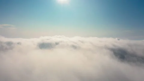 Aerial Flight above and through the moving cloudscape Stock Footage 140097882