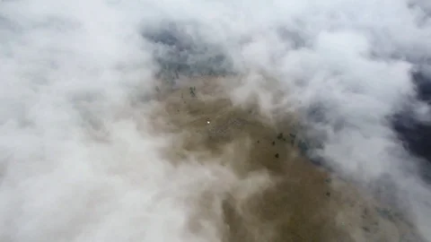 Aerial Flight Above Cloud Inversion In Dark Mountains With Drone Stock Footage 79697223