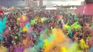 Aerial Flight Above Dancing People Crowd On Holi Festival Of Colors Stock Footage