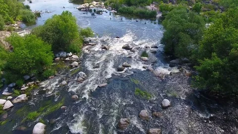 Aerial  flight above fast river running Stock Footage 80901391