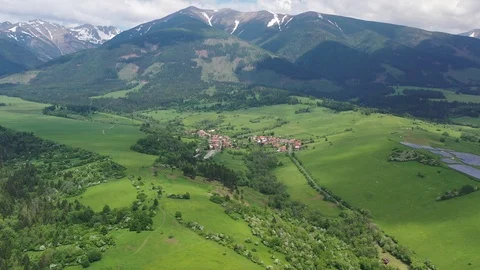 Aerial flight above settlements and solar power plant in High Tatra mountains Stock Footage 114297929