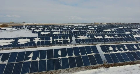 Aerial flight above of the Solar Panels covered by snow. Close-up view - 11 Stock Footage 86561553