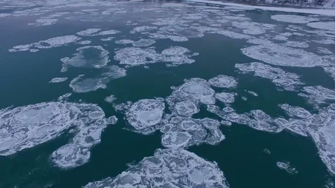 AERIAL: Flight above winter river during ice drift. Stock Footage 83812902