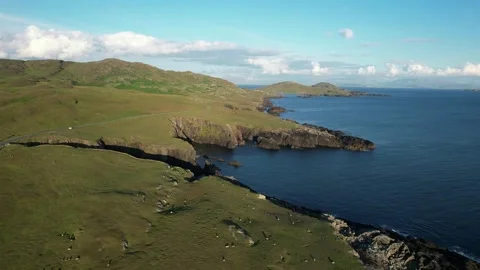 Aerial flight along Atlantic cliffs at golden hour, Achill Island, Ireland Stock Footage 346745809