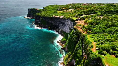 Aerial flight along dramatic cliffs of Bukit Peninsula Bali near Uluwatu Stock Footage 327616091