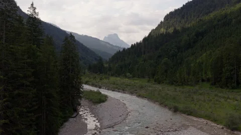 Aerial Flight Along Mountain River Through Alpine Forest in Eng Alm Austria Stock Footage 340488510