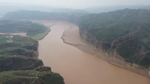 Aerial Flight Along Yellow River Canyon With Towering Sandstone Cliffs 07 Stock Footage 337788152