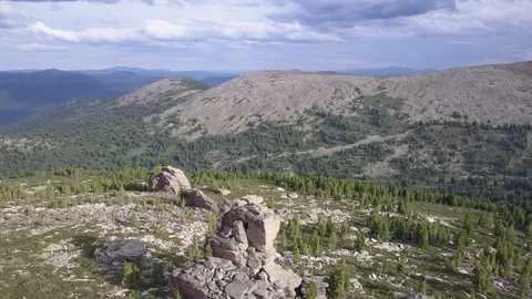 Aerial flight around single rock. Mountain panorama with Manas lake. Altai. 動画素材 84574979