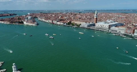 The aerial flight back of drone. View of the Wien surrounded by river full of Stock Footage 82244026