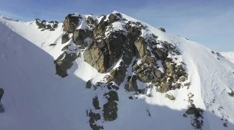 Aerial Flight Beautiful Snowy Rocky Mountain Slope Swiss Alps Winter Ski Stock Footage