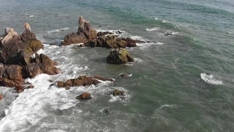 Aerial Flight between the Cliffs of Southwestern Coast of Indian Ocean Stock Footage 140721783