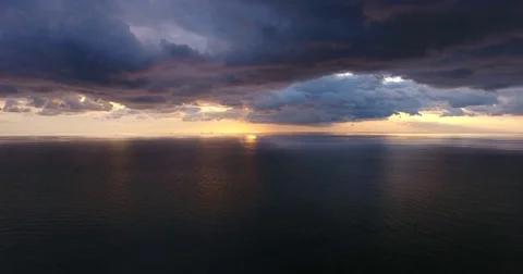 Aerial flight between the sea and the evening sky - 7 Vídeo Stock 79739166