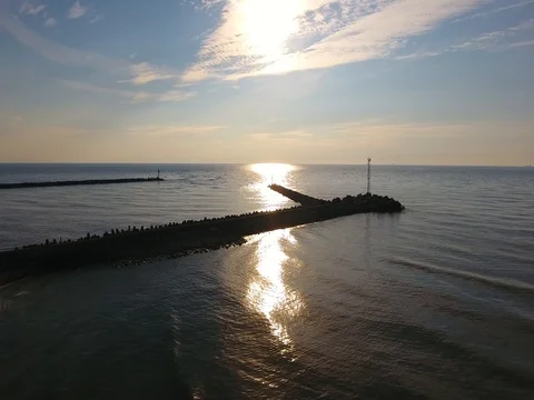 Aerial flight between the sea and the evening sky - 2 Stock Footage 80217031