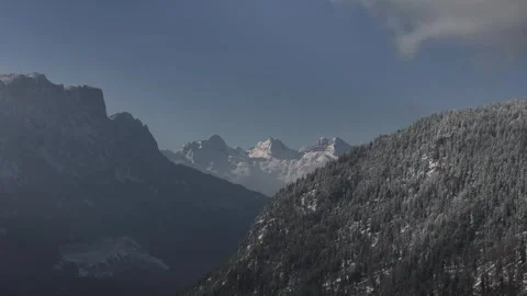 Aerial Flight Between Snow-Covered Peaks and Majestic Summit in the Alps Stock Footage 302647026