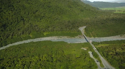 Aerial flight of bridge over a river in the mountains of New Zealand Stock Footage 55539601