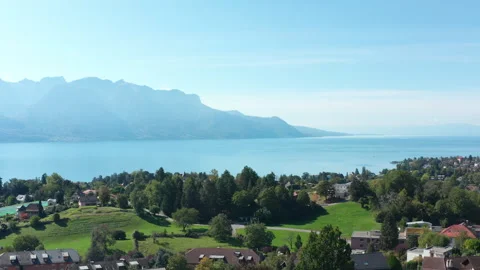 Aerial flight. The camera follow down along the tree in Montreux City and View Video stock 246926264
