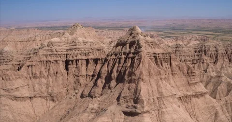 Aerial flight in the desert over sharp sandy cliffs, mountains. Stock Footage 105905814