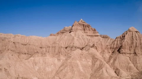 Aerial flight in the desert over sharp sandy cliffs, mountains. Stock Footage 105905976