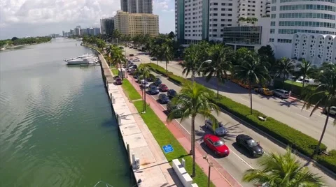 Aerial flight down Collins Avenue Stock Footage 60982498