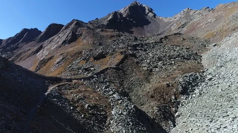 Aerial flight with drone over First World War military walls in the Italian Alps Stock Footage 99729079