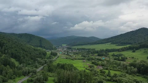 Aerial flight of a drone over a small city Stock Footage 249441570