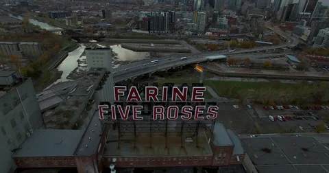 Aerial flight of the Farine Five Roses Neon sign in Montreal. Canada. Shot in Stock Footage