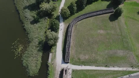 Aerial Flight Forward Over Biskupin Fortifications and Lake Path Stock Footage 325819787