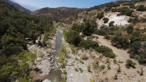 Aerial flight of fpv drone over the river cajon del maipo, chile Stock Footage 219999426