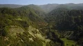 Aerial flight green mountains and valley landscape with road traffic La Palma 4k 4k or 4k+ Resolution