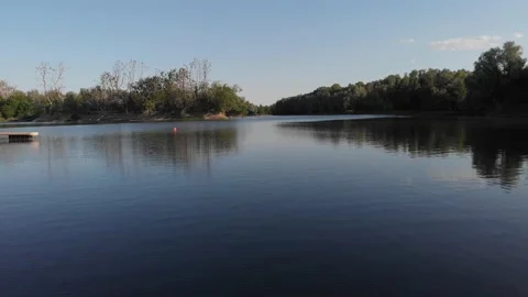 Aerial flight just above lake. Stock Footage