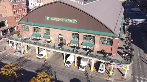 Aerial flight laterally looking at the St Lawrence Market in Toronto with a car  Stock Footage 151934052