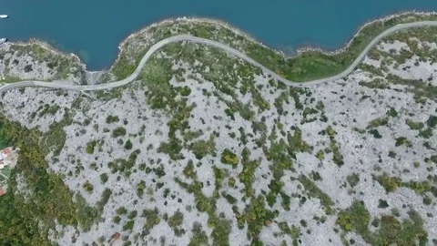 Aerial flight looking down on cliffs and coast line Stock Footage 82809578