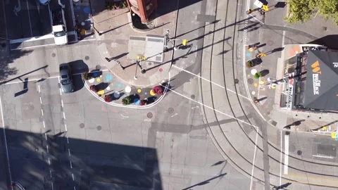 Aerial flight looking straight down at 2 firetrucks with their lights on respond Vídeos de archivo 151934858