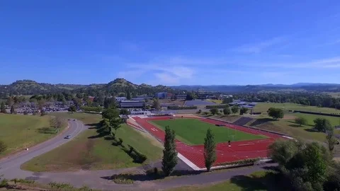 Aerial  flight low through grape vines california butte college reveal Stock Footage 82721693