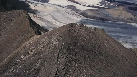 Aerial Flight of a Man Climbing Up Difficult Mountain Rock Slope. Road To Stock Footage 203824003