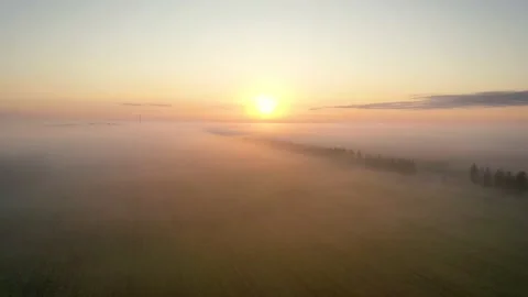 Aerial Flight To Meet The Sunset Through Clouds Of Fog Stock-Footage 130940282