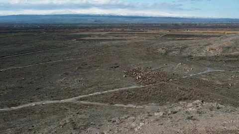 Aerial flight in mountains. Deserted empty hot dry landscape with rocks, grazing Stock Footage 163238503