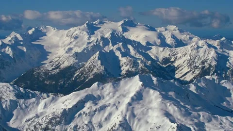 Aerial flight in the Olympic Mts, Mt. Olympus in the background Stock Footage 165527732
