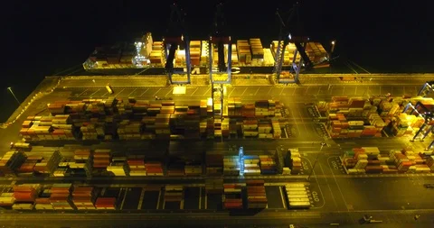 Aerial: flight over the container ship anchored in the port quay - 8 Stock Footage 98312071