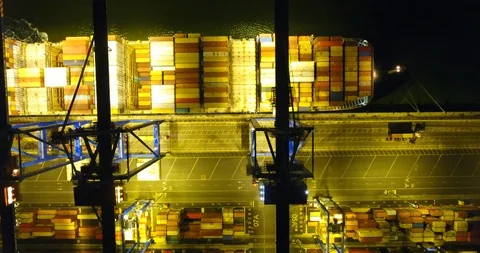 Aerial: flight over the container ship anchored in the port quay - 10 動画素材 98312118