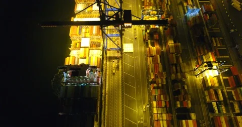 Aerial: flight over the container ship anchored in the port quay - 11 Stock Footage 98312126