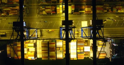 Aerial: flight over the container ship anchored in the port quay - 13 動画素材 98312171