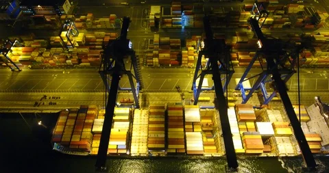 Aerial: flight over the container ship anchored in the port quay - 12 Stock Footage 98312172