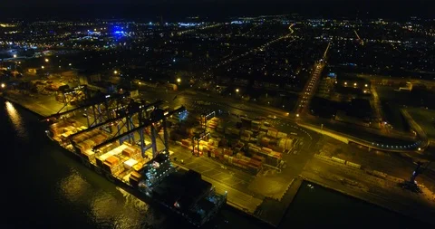 Aerial: flight over the container ship anchored in the port quay - 19 Stock-Footage 98312312