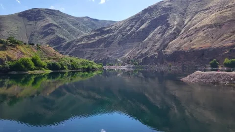 Aerial Flight Over Crystal Clear River Between Mountain Valleys Video stock 340165158