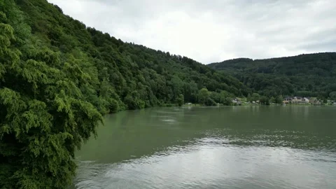 Aerial Flight Over the Danube River in Austria with Green Hills and Trees Stock Footage 251754035