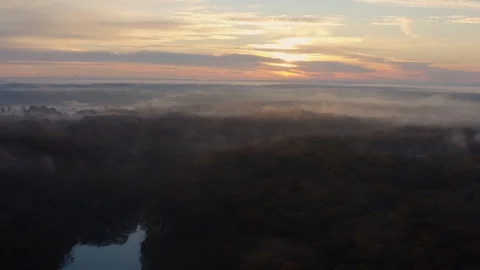 Aerial flight over a fall forest with a light fog and a river Stock Footage 111650012