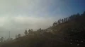 Aerial flight over foggy sunny mountain road at clouds altitude 4k 4k or 4k+ Resolution