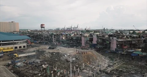 Aerial flight over garbage dump towards poor housing area, Manila, Philippines Stock-Footage 129523667